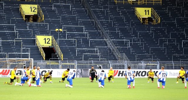 Bundesliga clubs, led by Borussia Dortmund, grumble as games go back behind closed doors